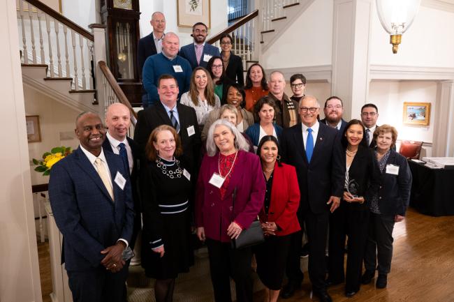 The governor poses for a photo with 2023 Outstanding Leadership Awards winners