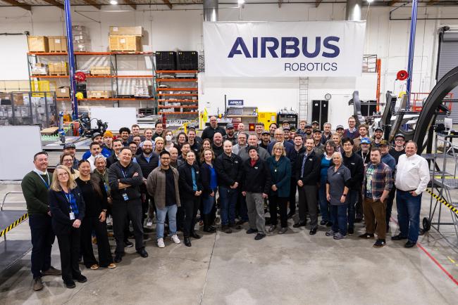 Employees at Airbus Robotics in Mukilteo pose for a group picture with Gov. Jay Inslee.